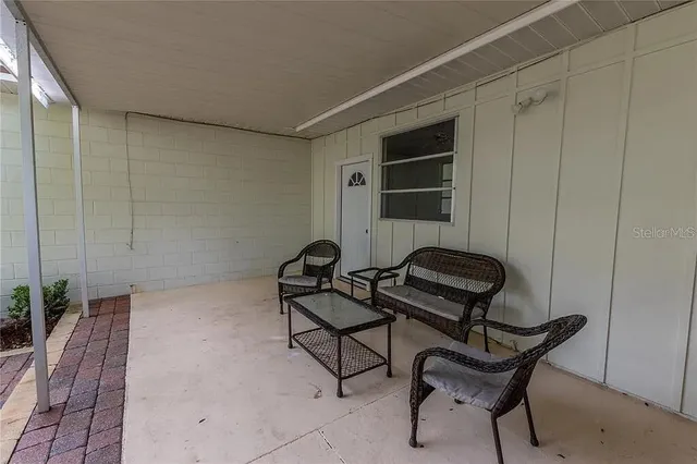 a view of a livingroom with furniture and hardwood floor