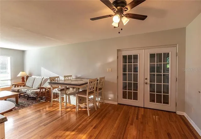 a view of a barn house and a large tree