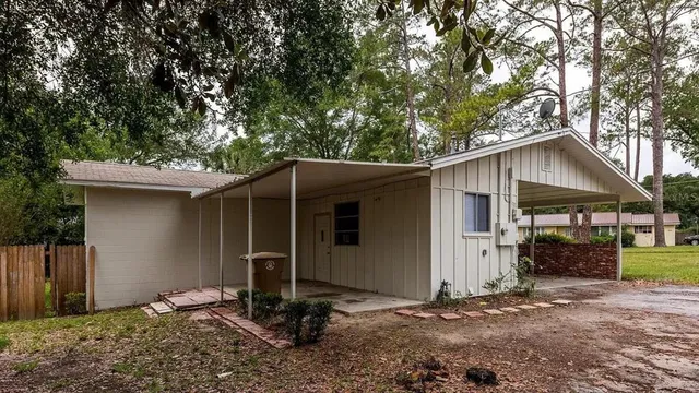 a bedroom with a bed and a bathroom