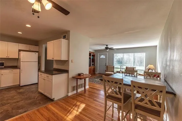 a view of a livingroom with workspace and a window