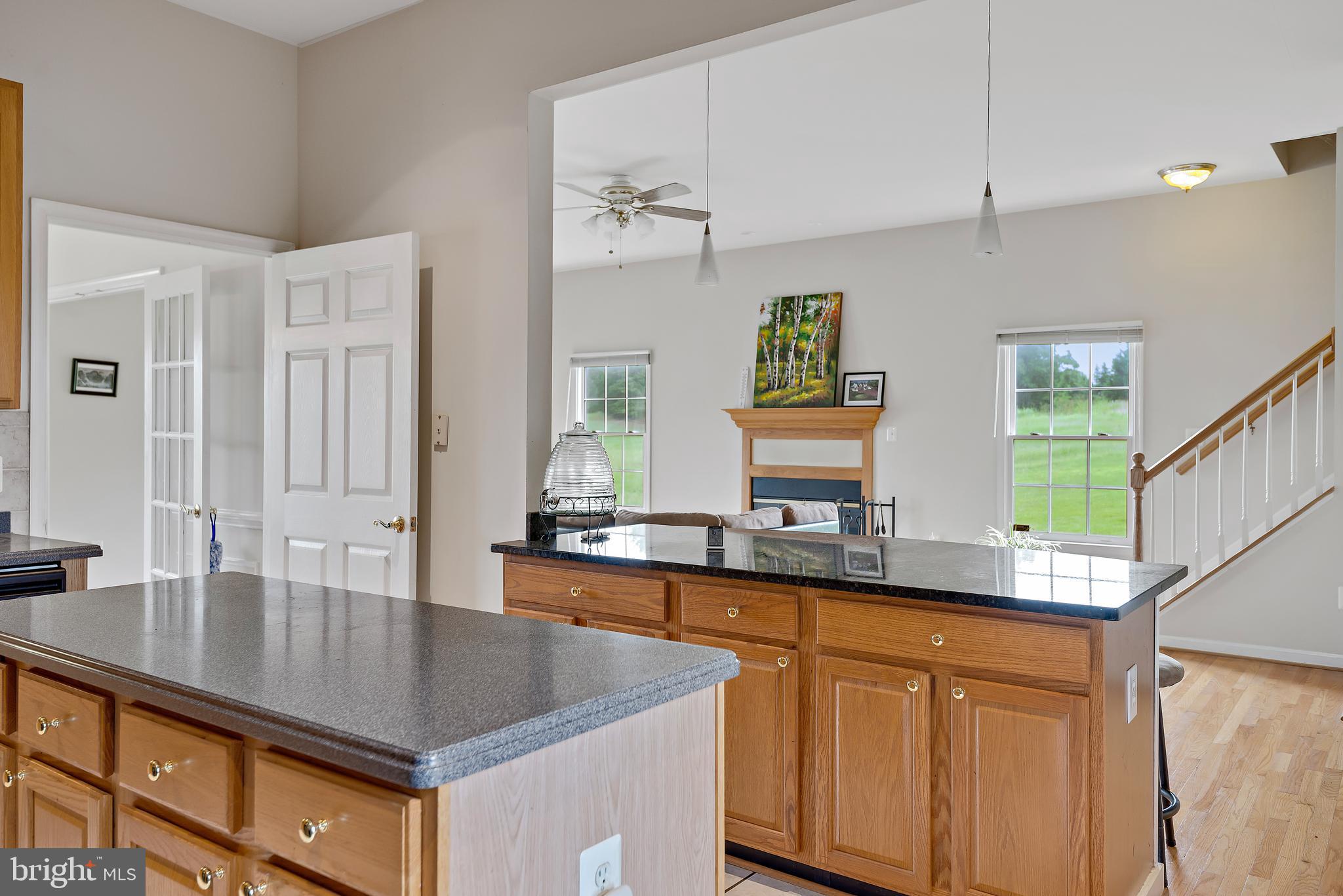 3356 Park Mills Road Frederick, MD 21704 - Photo 15 of 80 a kitchen with stainless steel appliances granite countertop a sink a stove and a granite counter tops with white cabinets