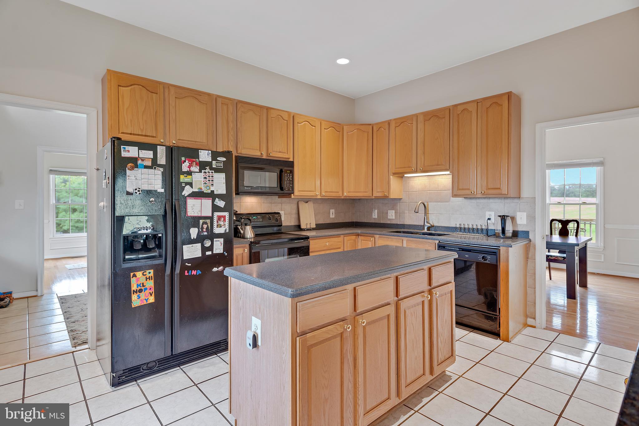 3356 Park Mills Road Frederick, MD 21704 - Photo 17 of 80 a kitchen with stainless steel appliances granite countertop a refrigerator and a stove top oven