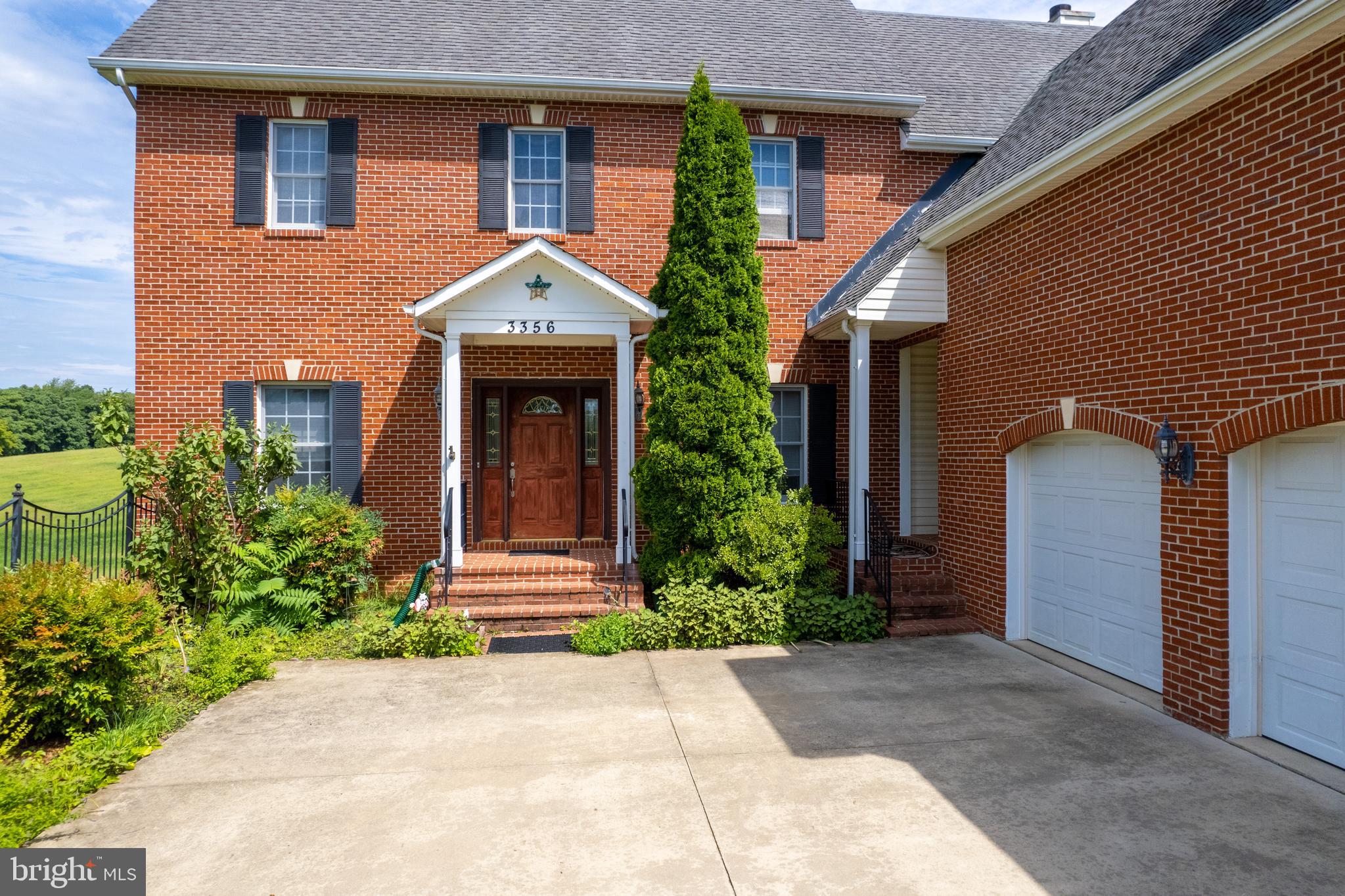 3356 Park Mills Road Frederick, MD 21704 - Photo 2 of 80 a front view of a house with garden