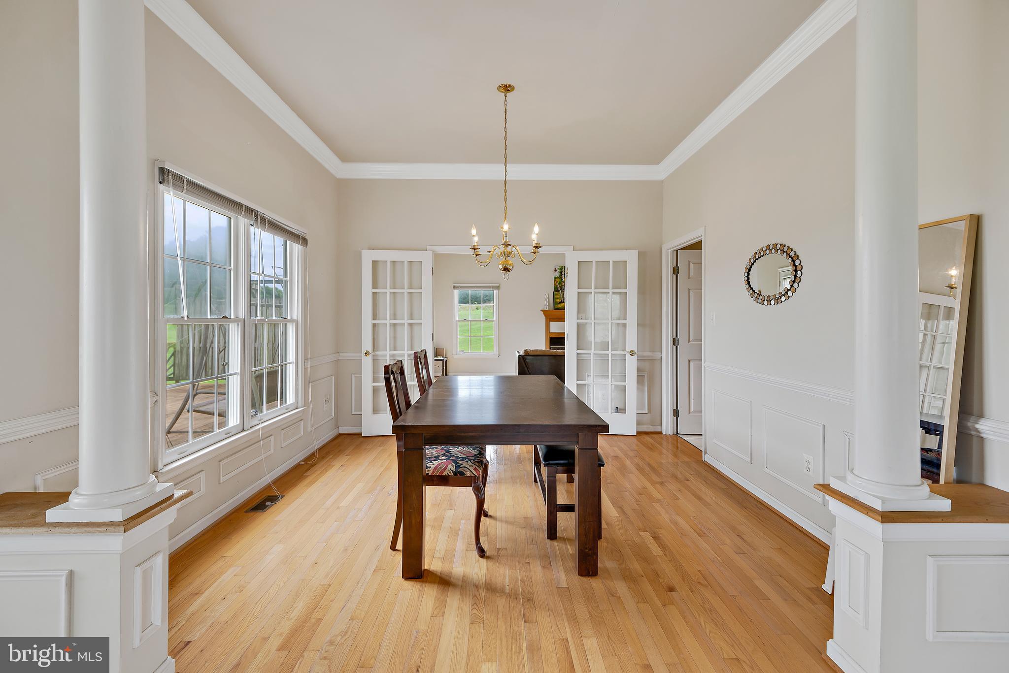 3356 Park Mills Road Frederick, MD 21704 - Photo 21 of 80 a view of a dining room with furniture window and wooden floor