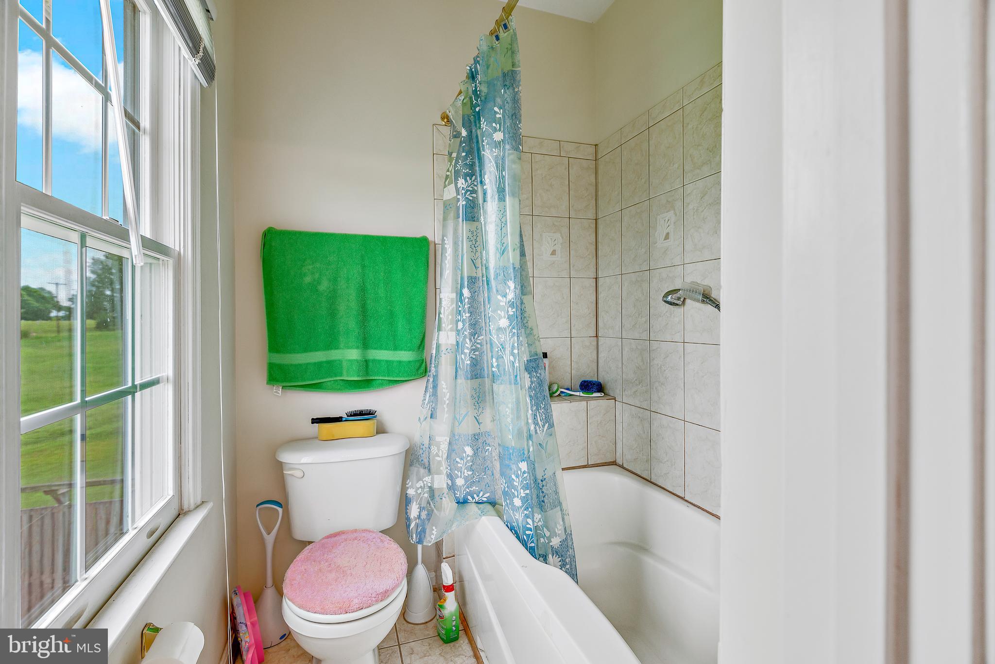 3356 Park Mills Road Frederick, MD 21704 - Photo 55 of 80 a white toilet sitting next to a bathroom sink