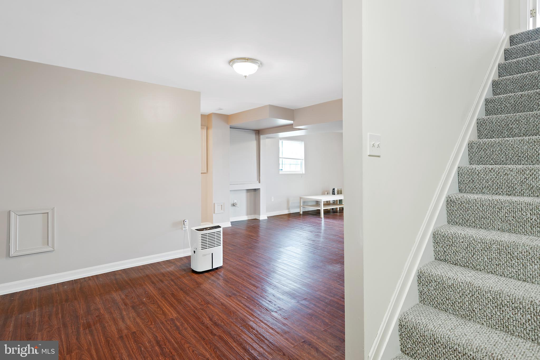 3356 Park Mills Road Frederick, MD 21704 - Photo 63 of 80 a view of an empty room with wooden floor and a window