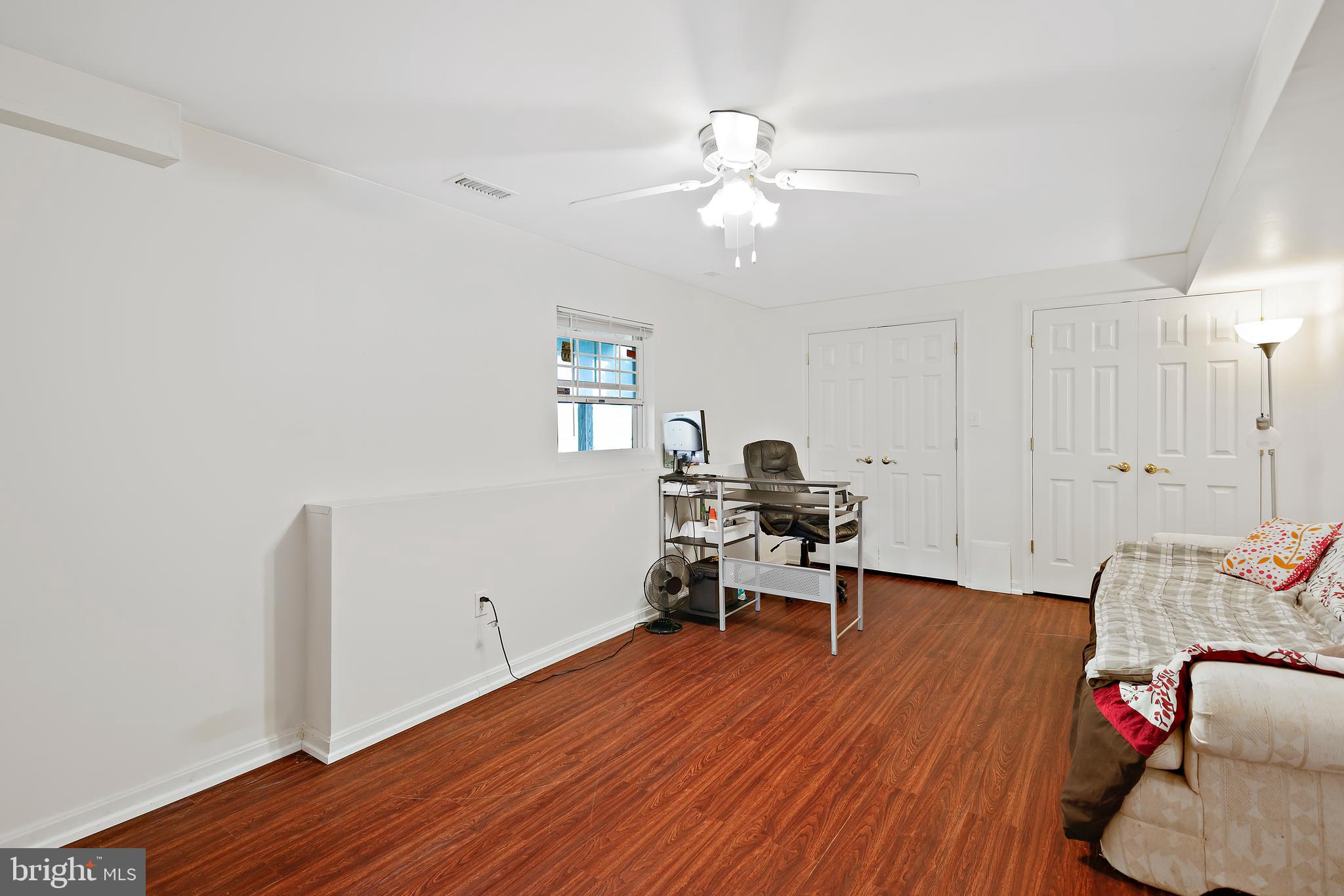 3356 Park Mills Road Frederick, MD 21704 - Photo 69 of 80 a view of a workspace with wooden floor and a chandelier