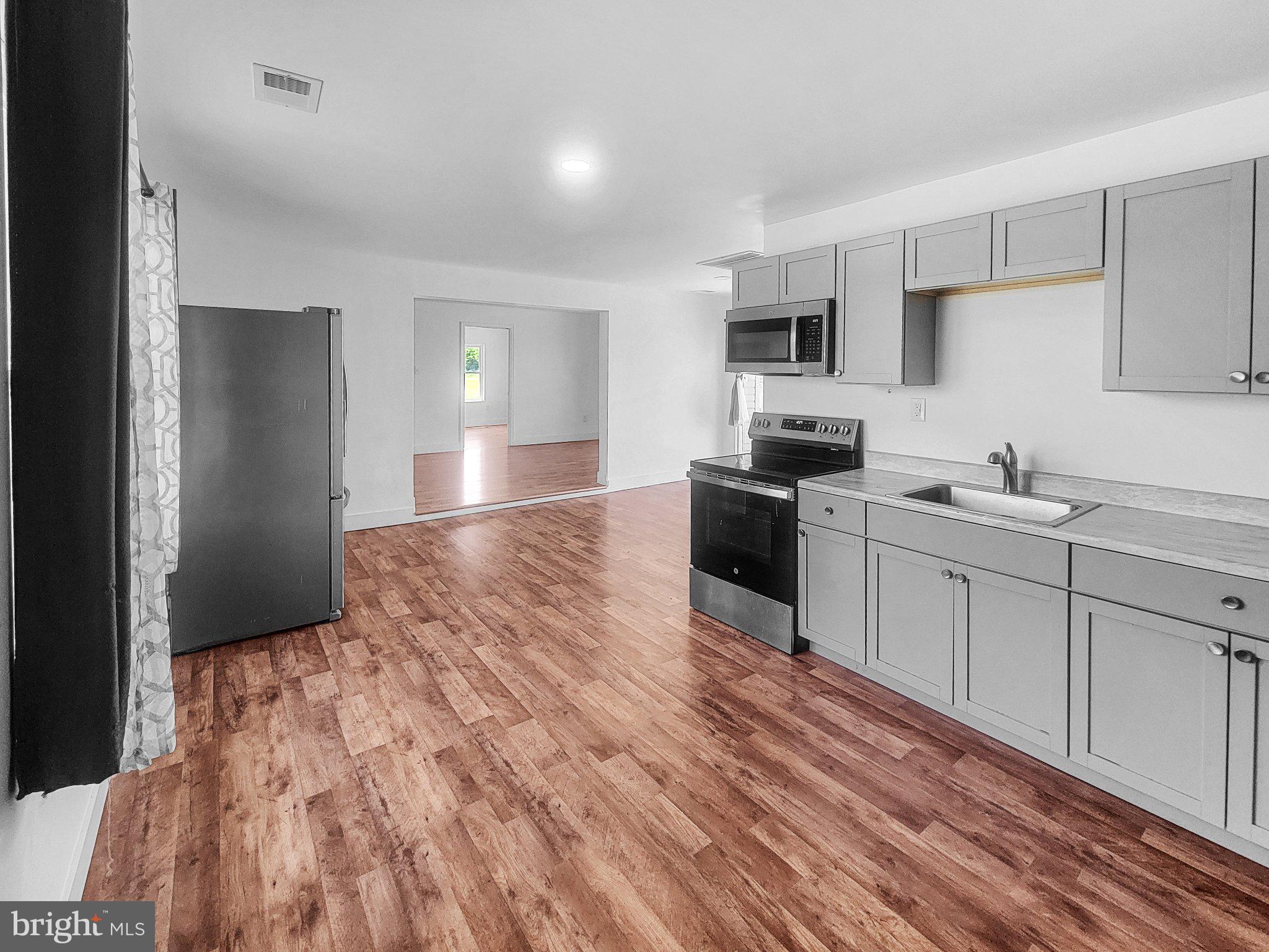 4658 White Marsh Road Madison, MD 21648 - Photo 12 of 25 Modern kitchen with open layout charm.