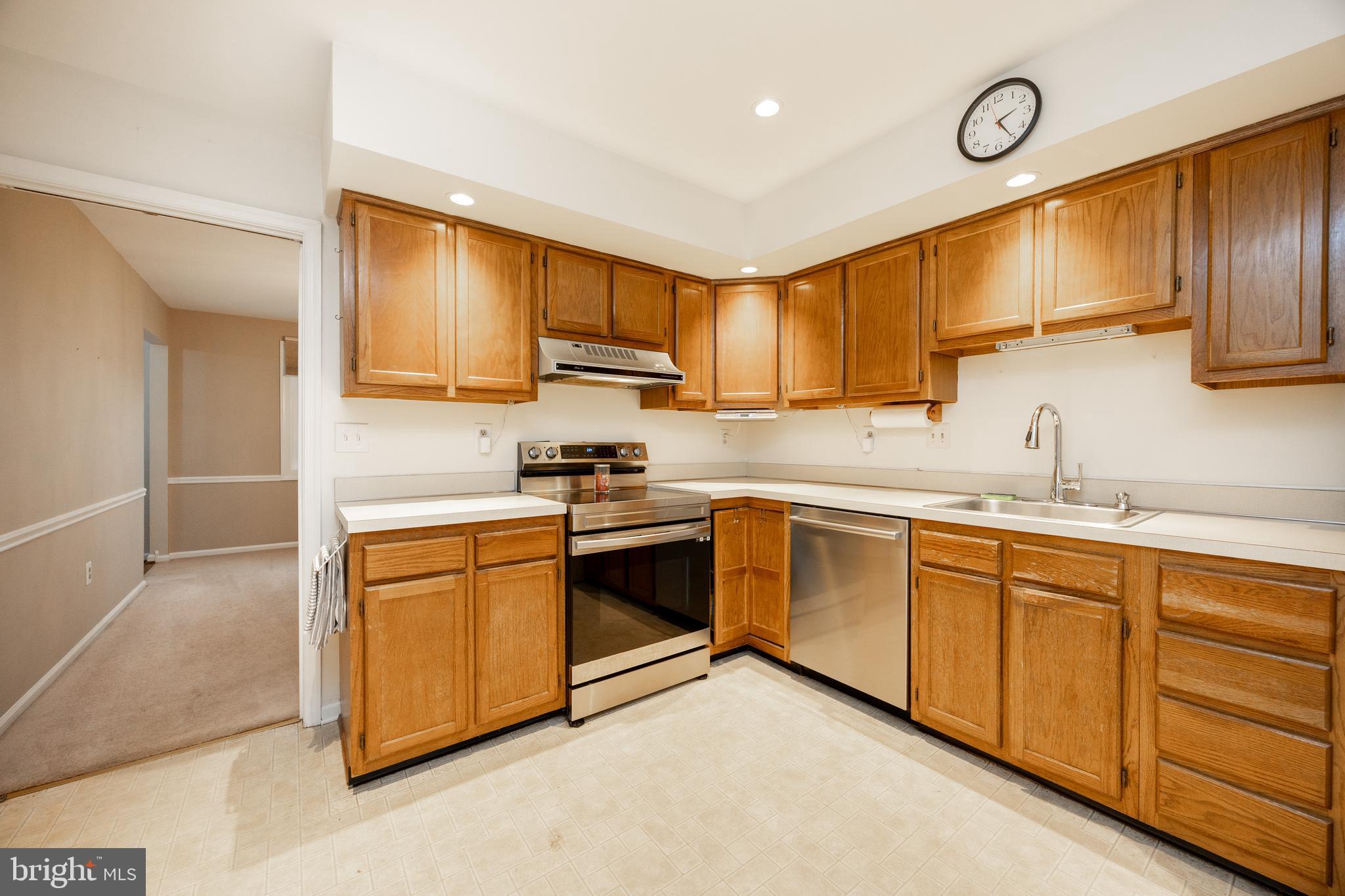 103 Stephen Drive Downingtown, PA 19335 - Photo 12 of 52 a kitchen with cabinets appliances a sink and a window