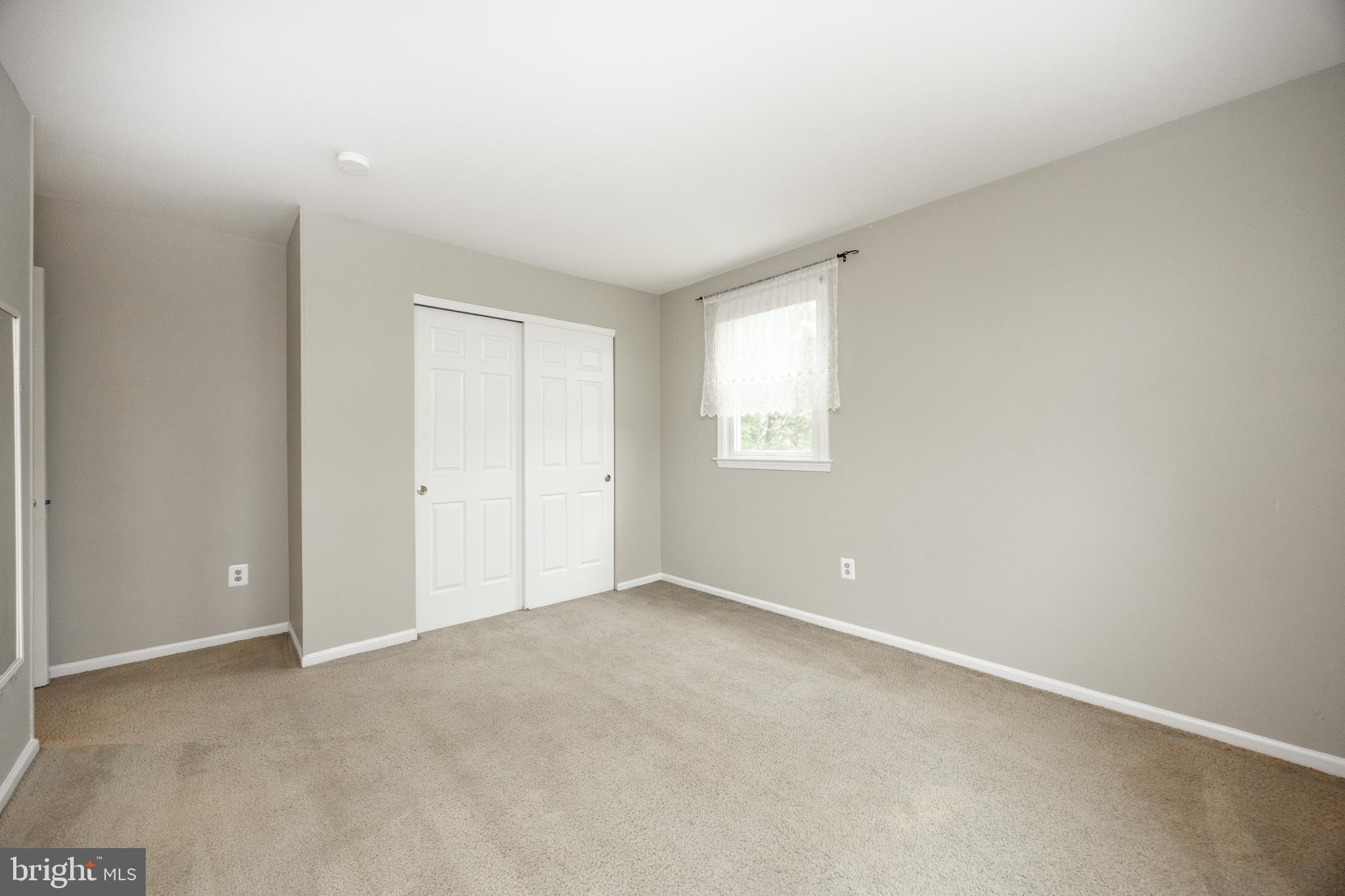 103 Stephen Drive Downingtown, PA 19335 - Photo 23 of 52 an empty room with windows and closet