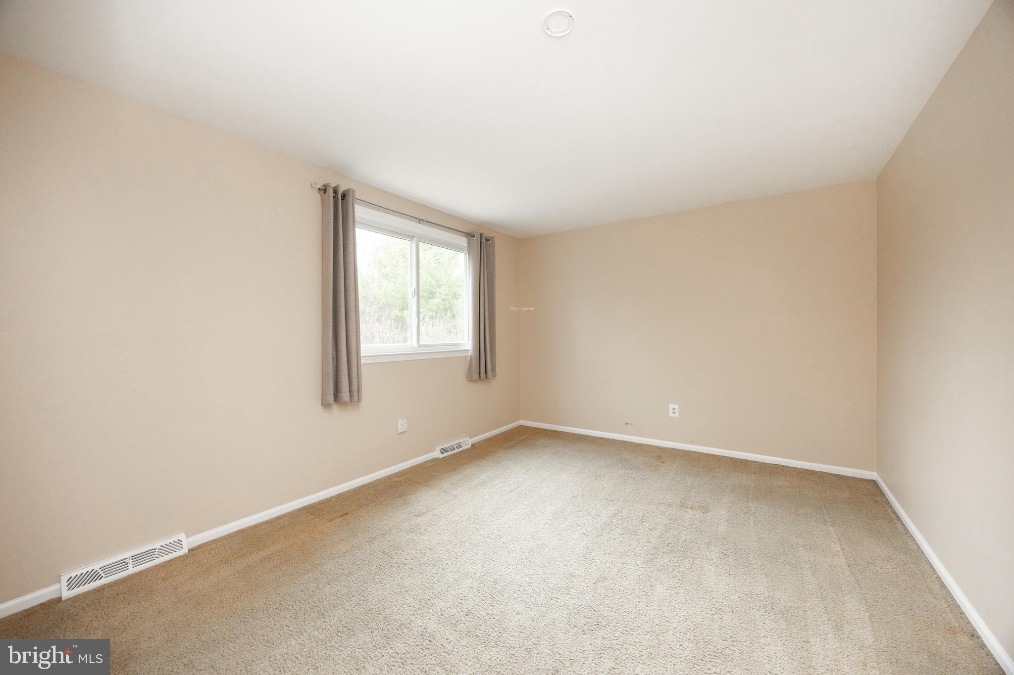 103 Stephen Drive Downingtown, PA 19335 - Photo 26 of 52 an empty room with a window