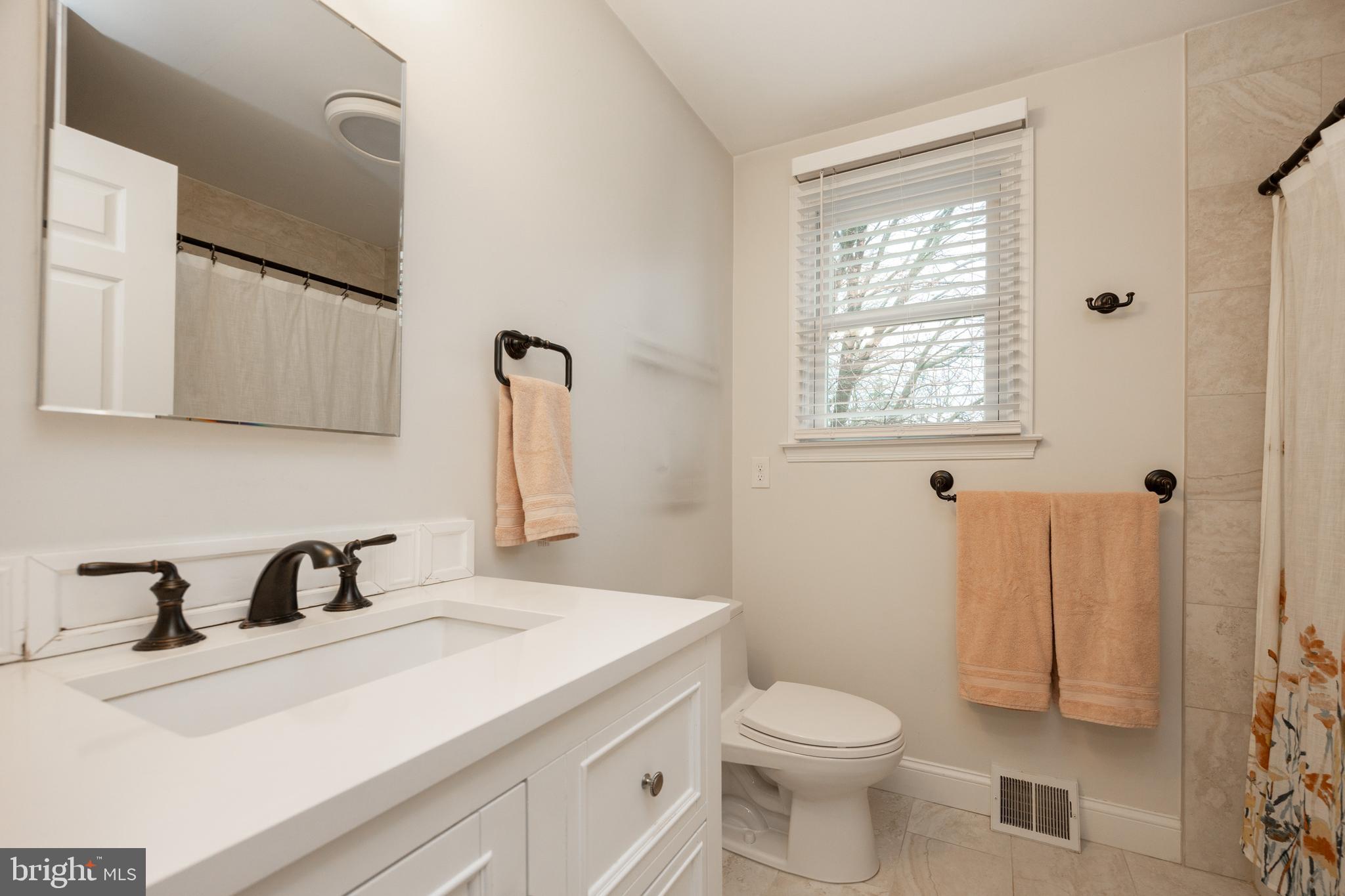 103 Stephen Drive Downingtown, PA 19335 - Photo 28 of 52 a bathroom with a sink a toilet and shower