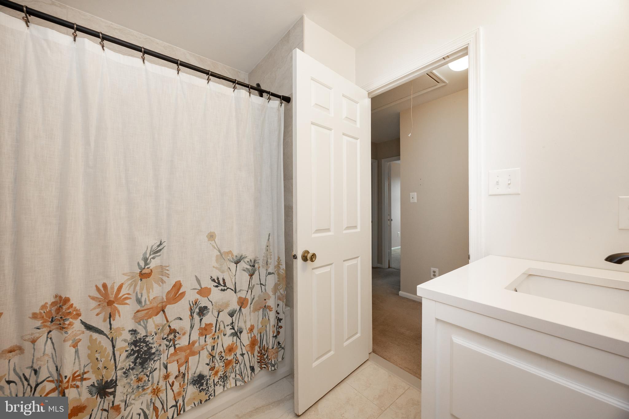 103 Stephen Drive Downingtown, PA 19335 - Photo 29 of 52 a bathroom with a shower curtain and a sink
