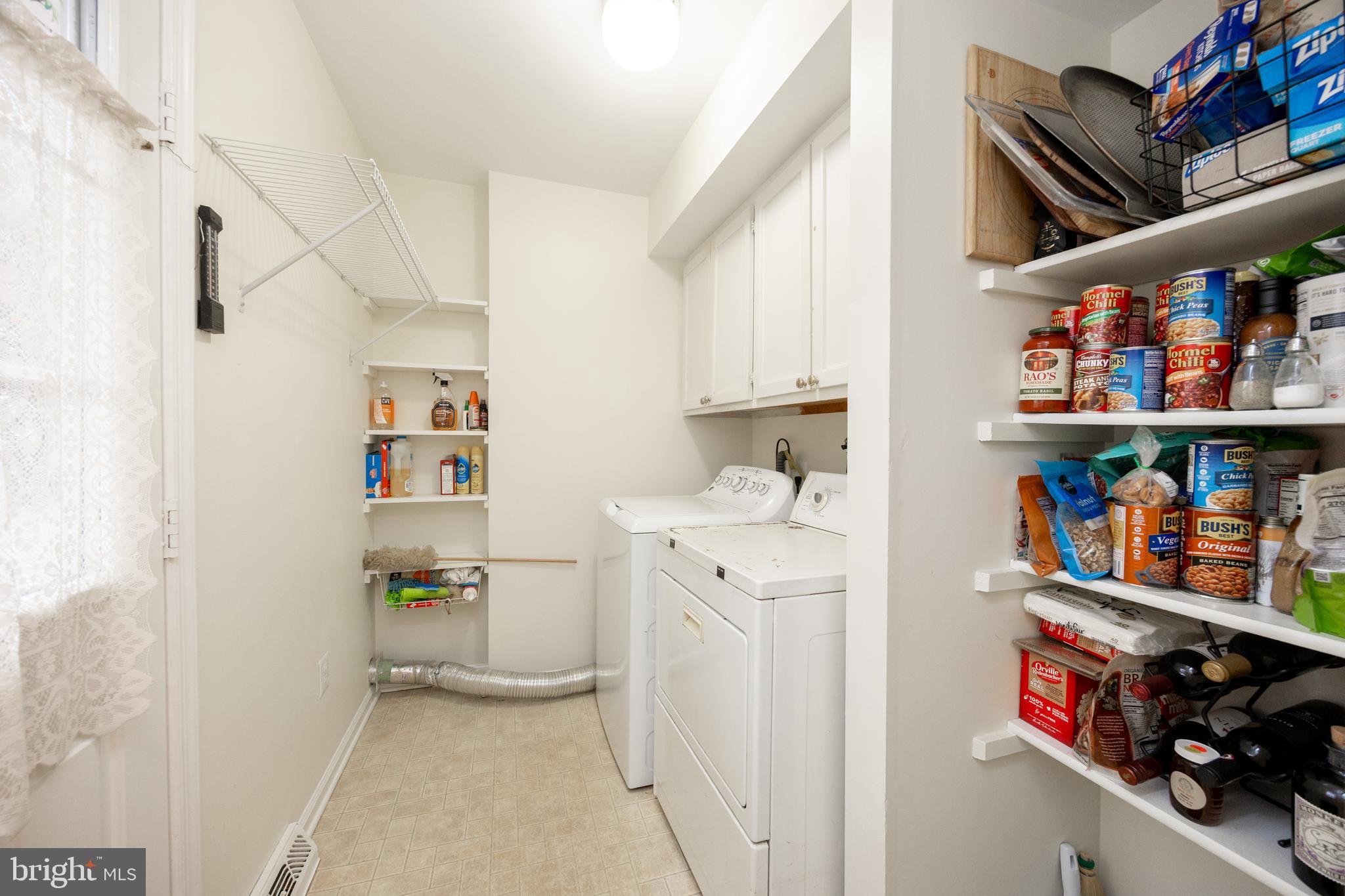 103 Stephen Drive Downingtown, PA 19335 - Photo 31 of 52 a storage room with wooden floor and cabinets