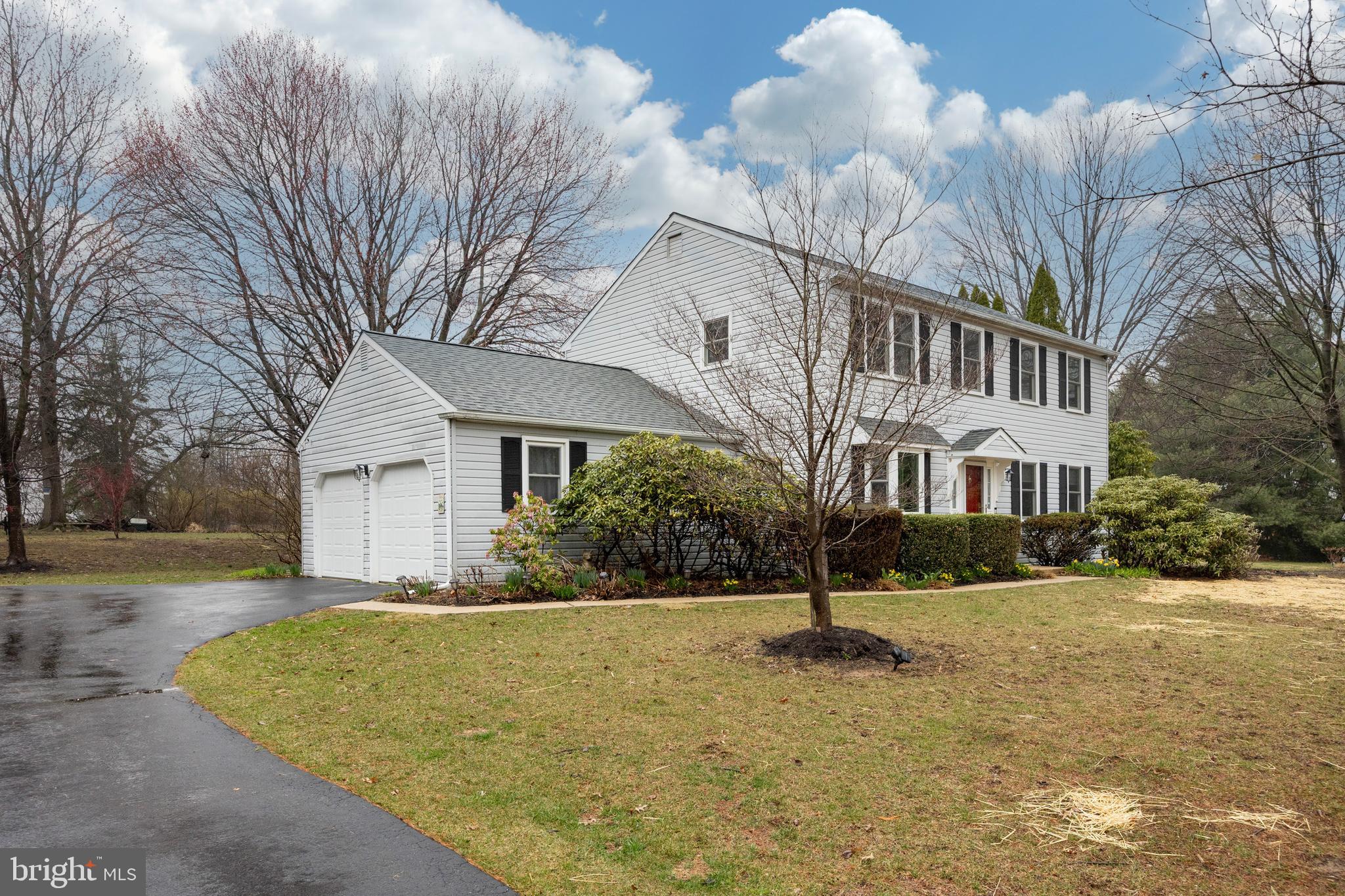 103 Stephen Drive Downingtown, PA 19335 - Photo 46 of 52 a view of a white house with a yard and a large tree