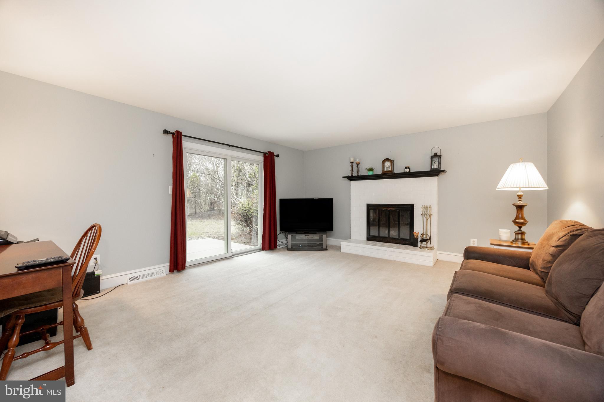 103 Stephen Drive Downingtown, PA 19335 - Photo 9 of 52 a living room with furniture and a fireplace