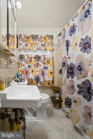 a view of a workspace with furniture and clutter