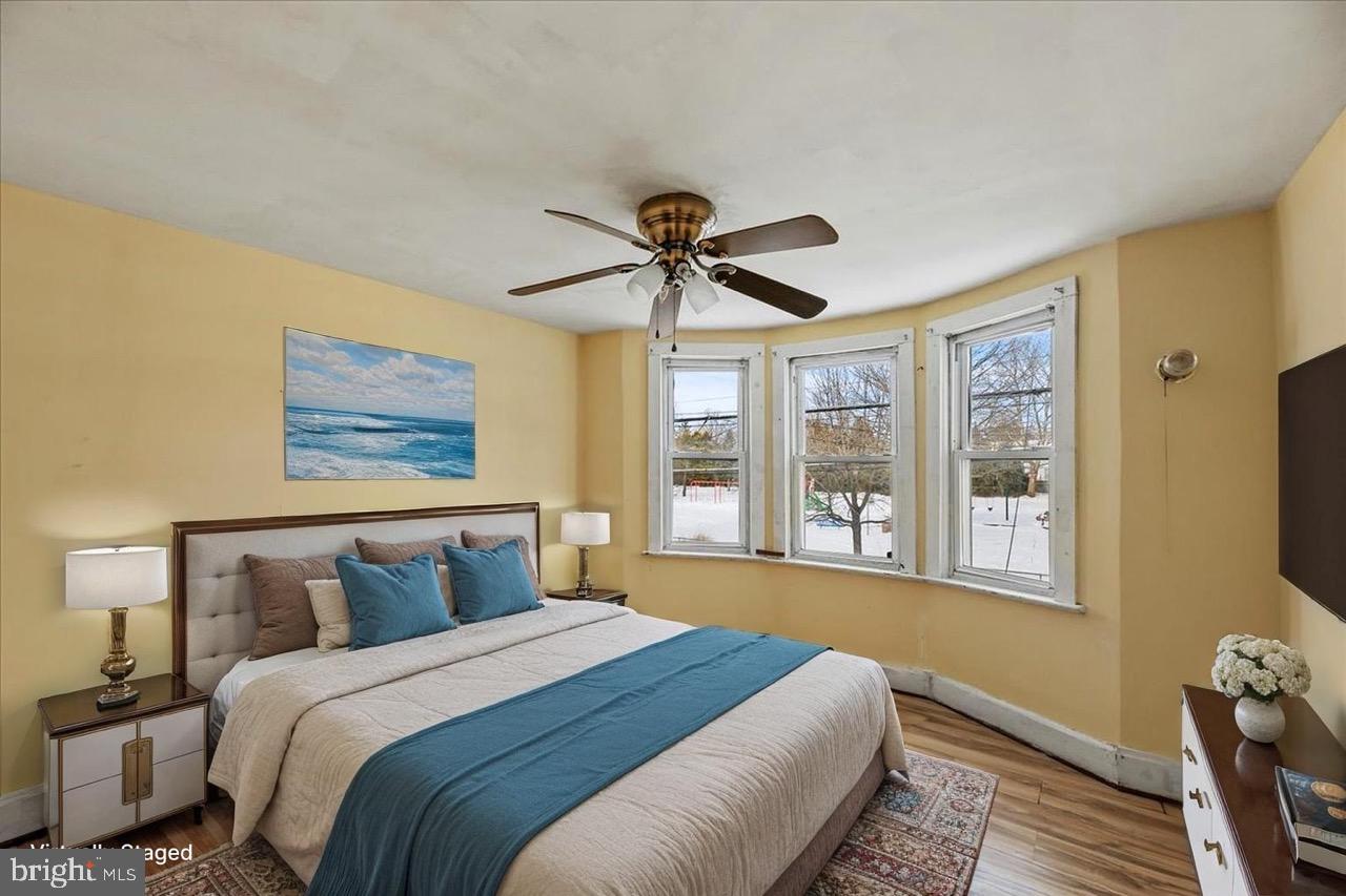 1267 Nottingham Way Hamilton, NJ 08609 - Photo 11 of 24 a bedroom with a large bed and a window