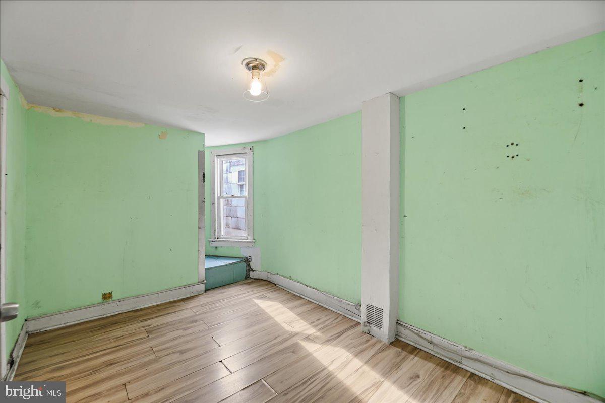 1267 Nottingham Way Hamilton, NJ 08609 - Photo 17 of 24 a view of empty room with wooden floor