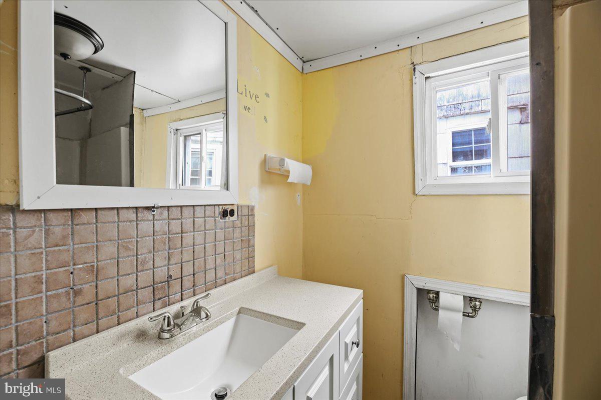 1267 Nottingham Way Hamilton, NJ 08609 - Photo 18 of 24 a bathroom with a sink and a vanity