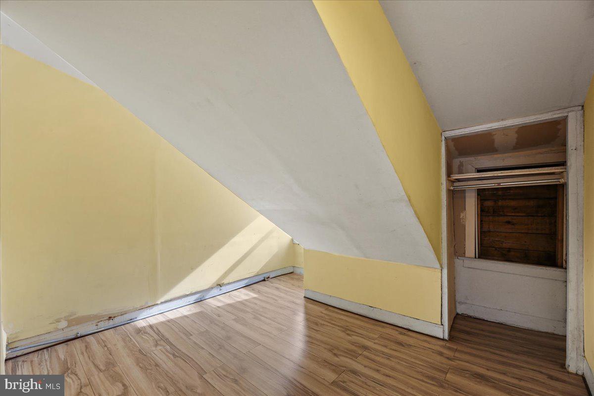 1267 Nottingham Way Hamilton, NJ 08609 - Photo 22 of 24 a view of a hallway with wooden floor and stairs