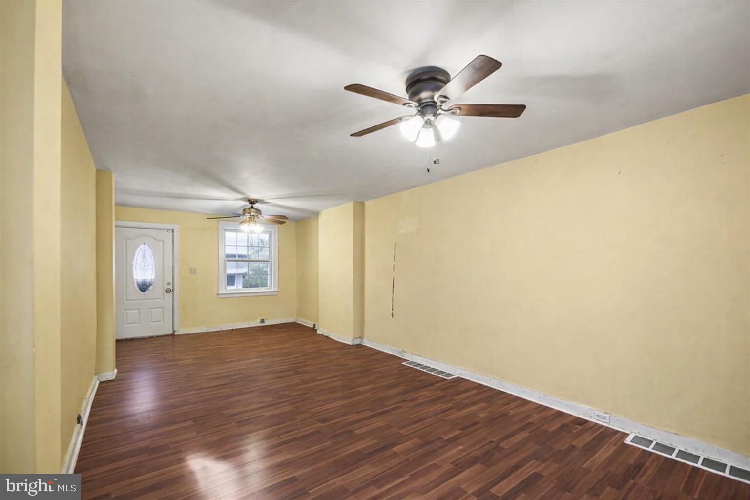 1267 Nottingham Way Hamilton, NJ 08609 - Photo 4 of 24 a view of empty room with wooden floor and fan