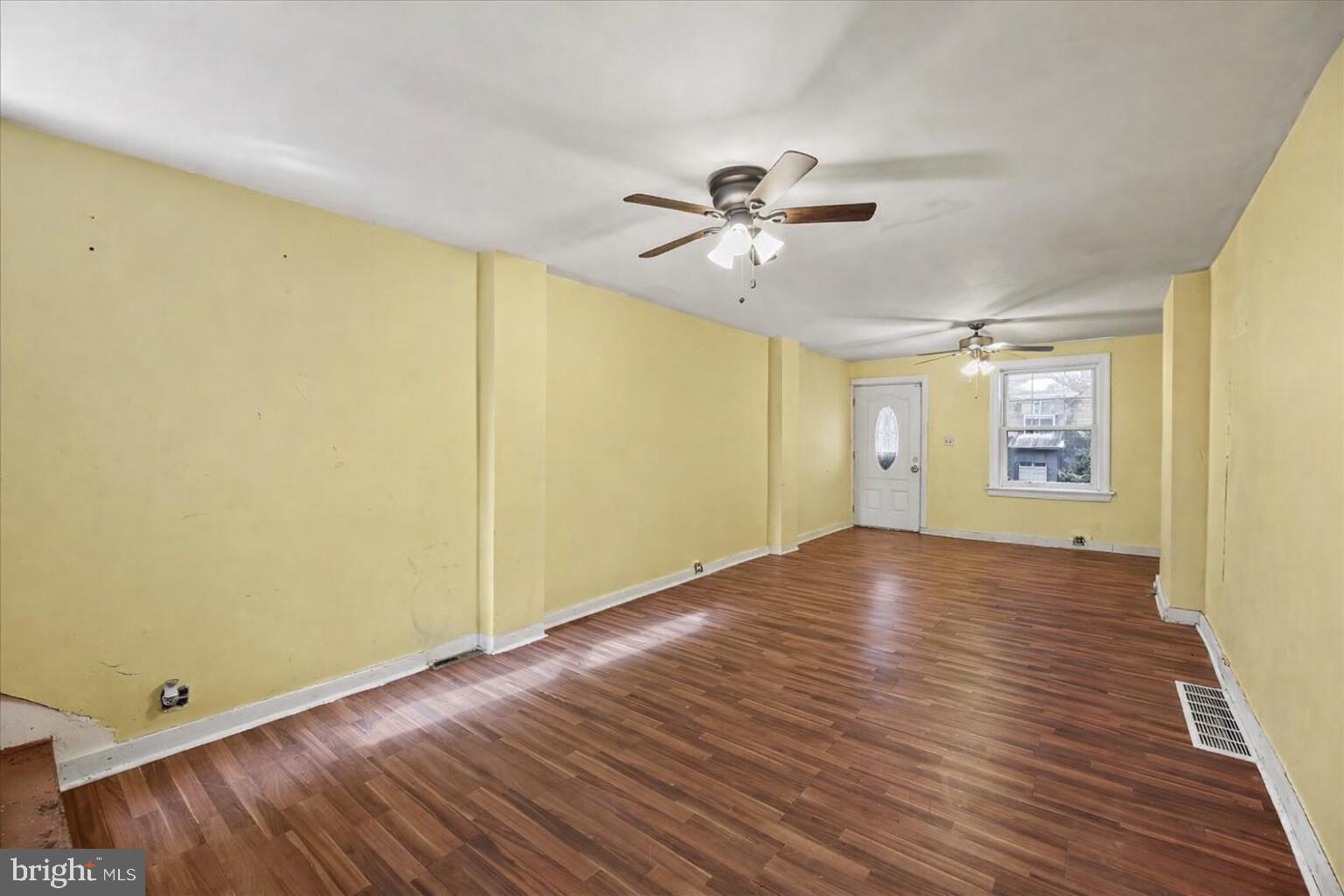1267 Nottingham Way Hamilton, NJ 08609 - Photo 5 of 24 a view of empty room with wooden floor and fan