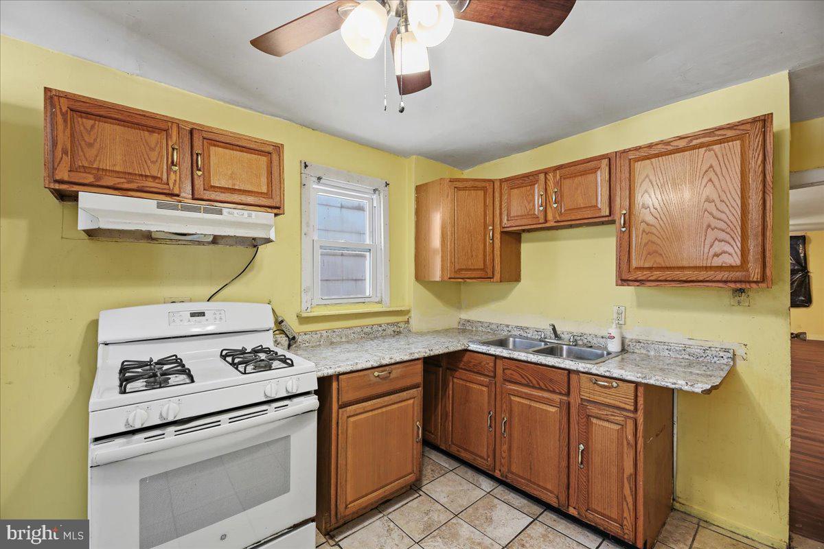 1267 Nottingham Way Hamilton, NJ 08609 - Photo 8 of 24 a kitchen with stainless steel appliances granite countertop a stove sink and cabinets