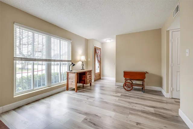 a kitchen with stainless steel appliances a refrigerator sink and cabinets