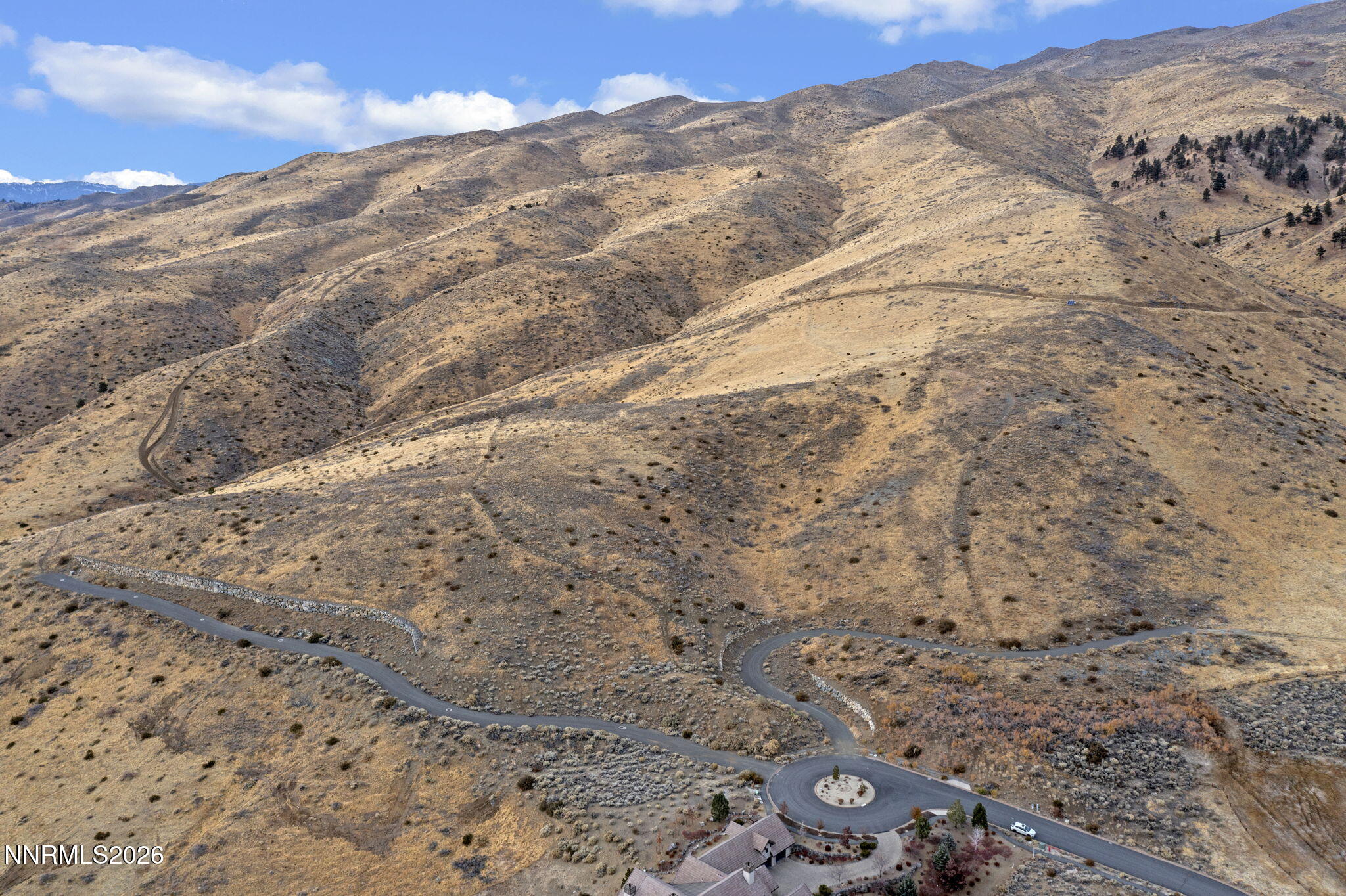 0 Painted River Trail Reno, NV 89523 - Photo 2 of 18 a view of a dry yard with mountains in the background