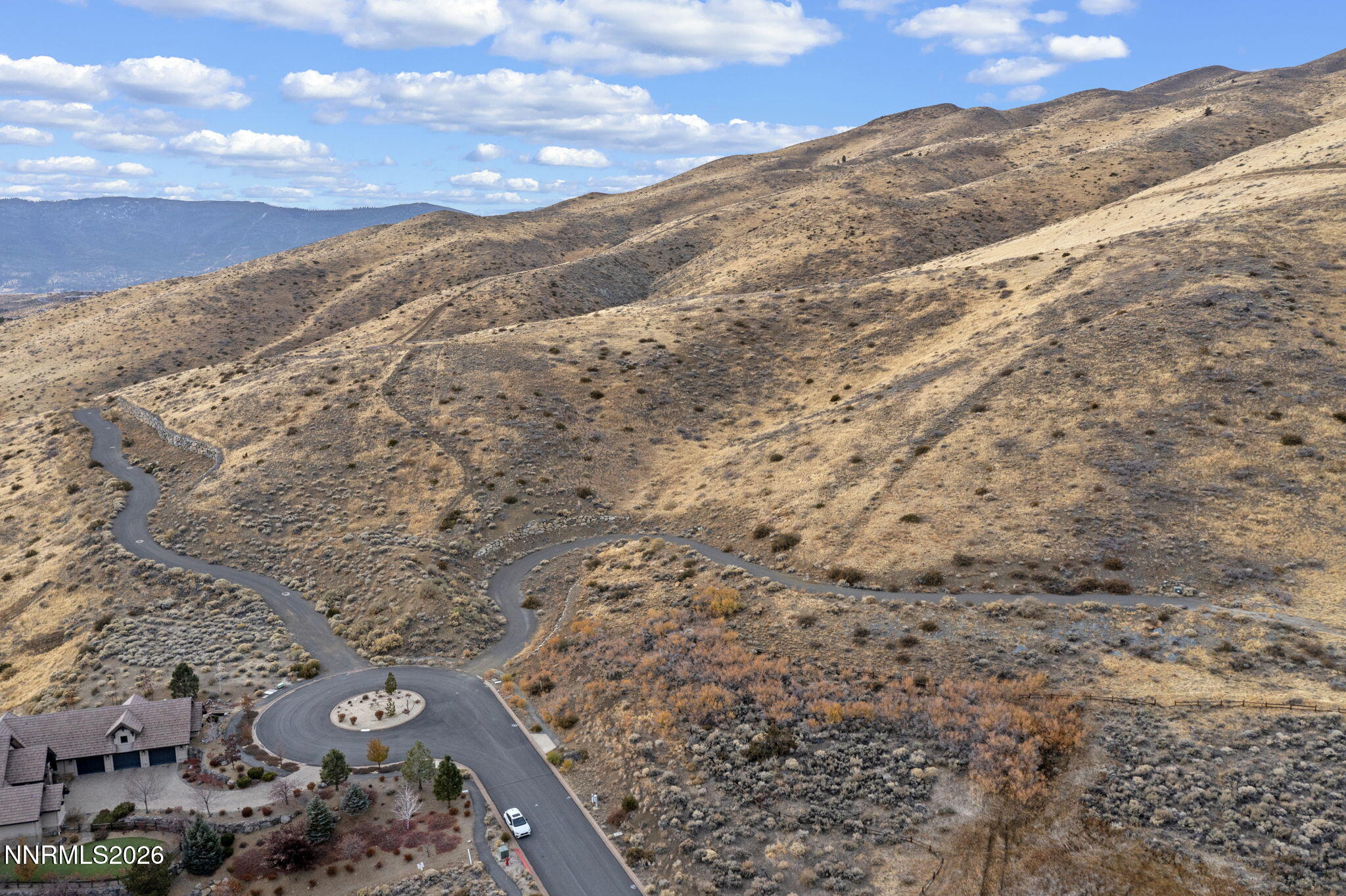 0 Painted River Trail Reno, NV 89523 - Photo 4 of 18 a view of a dry yard with mountains in the background