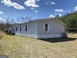 1016 Hooper Road Cleveland, GA 30528 - Photo 1 of 1 a view of a house with a yard