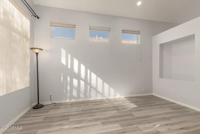 a view of an entryway with wooden floor