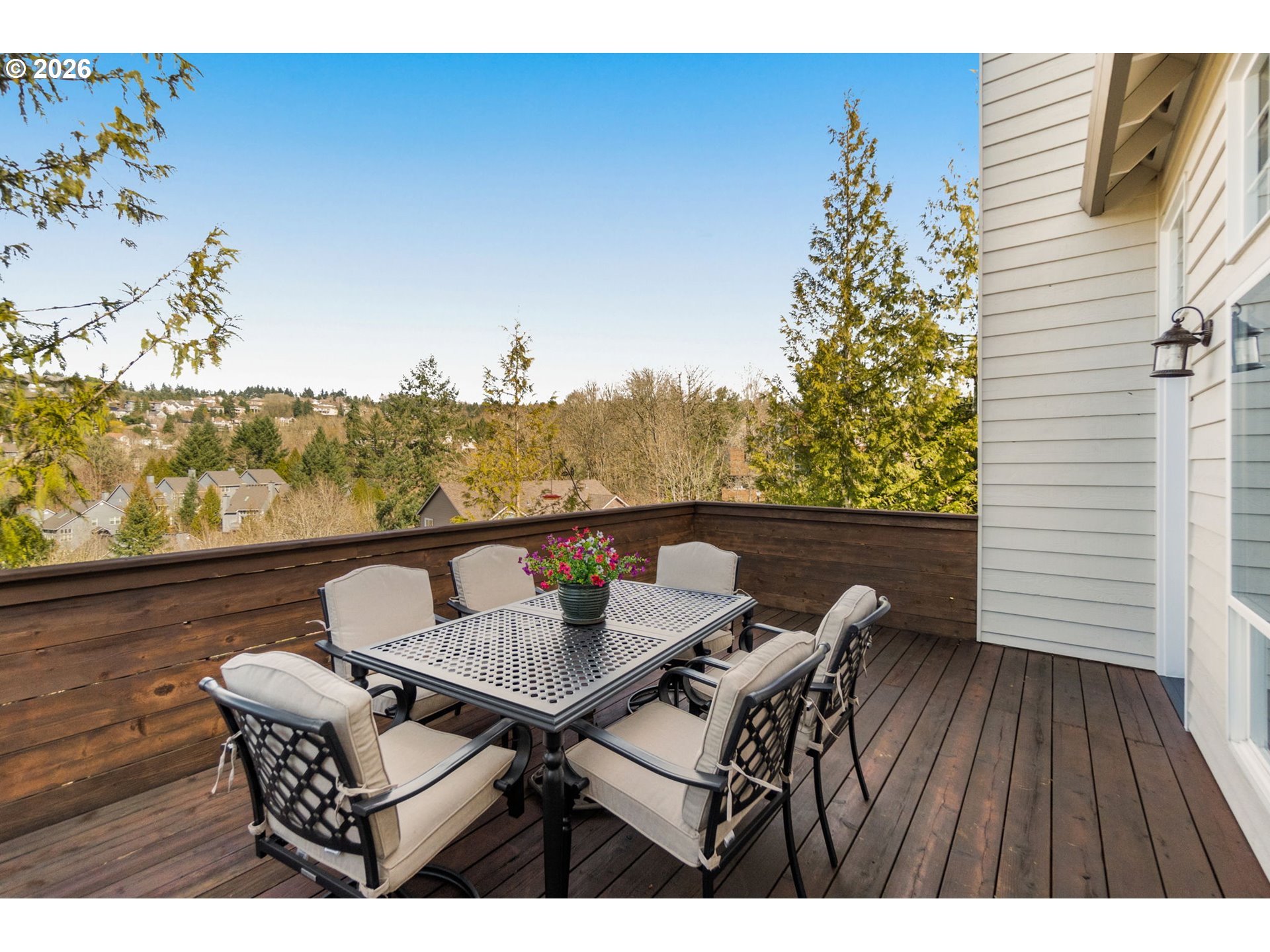 9625 Northwest Fleischner Street Portland, OR 97229 - Photo 11 of 39 a balcony with table and chairs