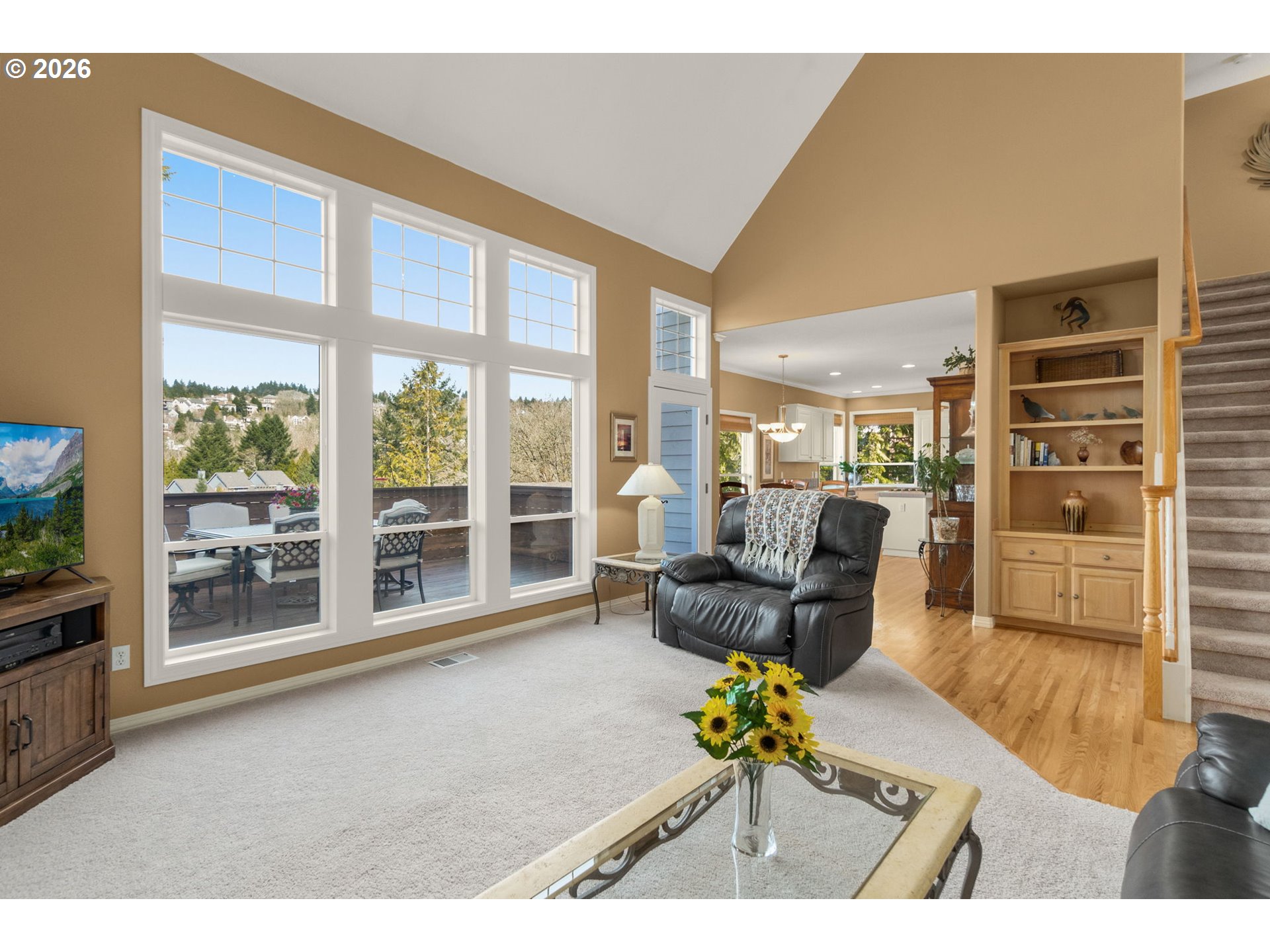 9625 Northwest Fleischner Street Portland, OR 97229 - Photo 12 of 39 a living room filled with furniture and a floor to ceiling window