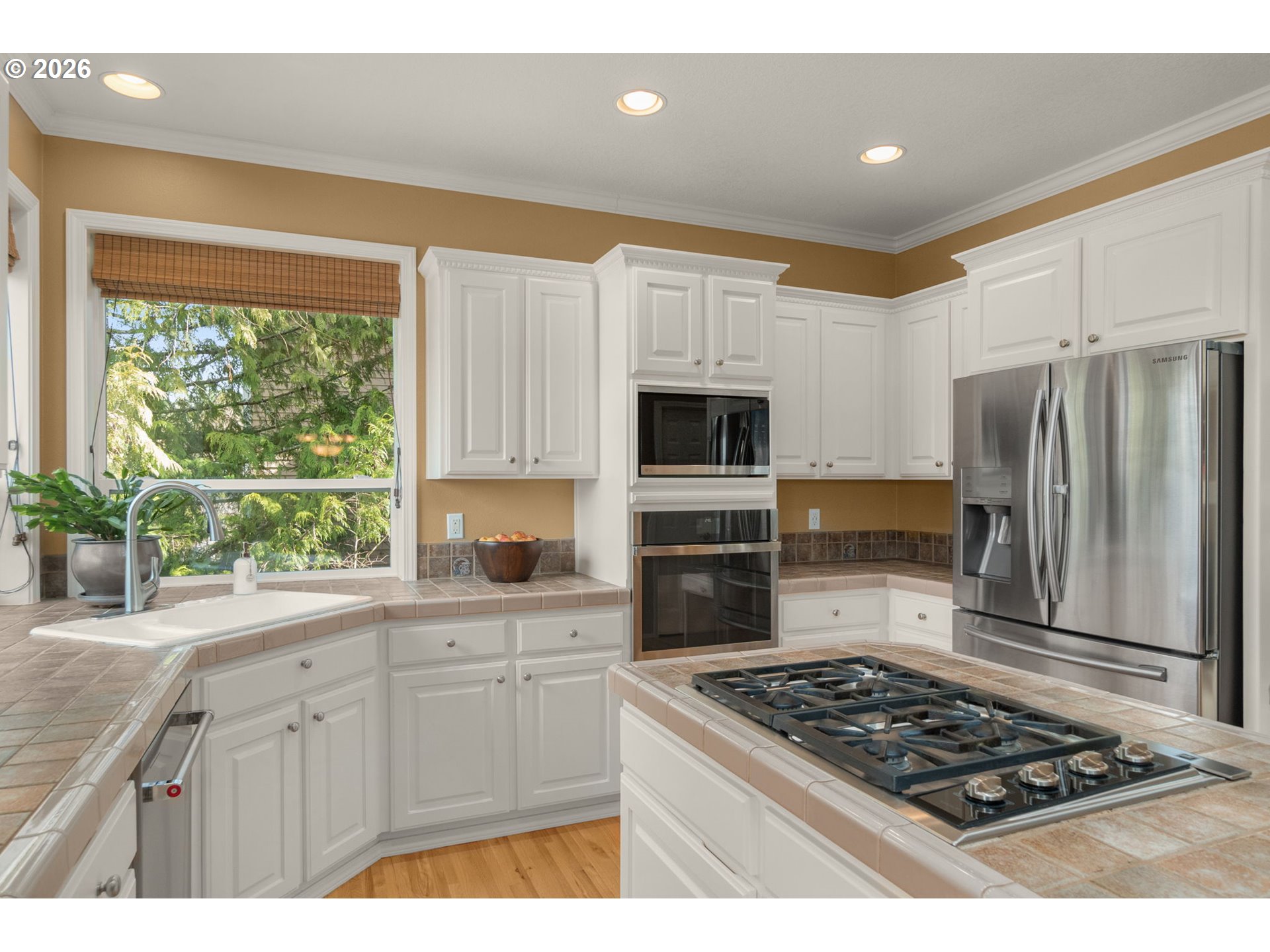 9625 Northwest Fleischner Street Portland, OR 97229 - Photo 17 of 39 a kitchen with white cabinets and appliances