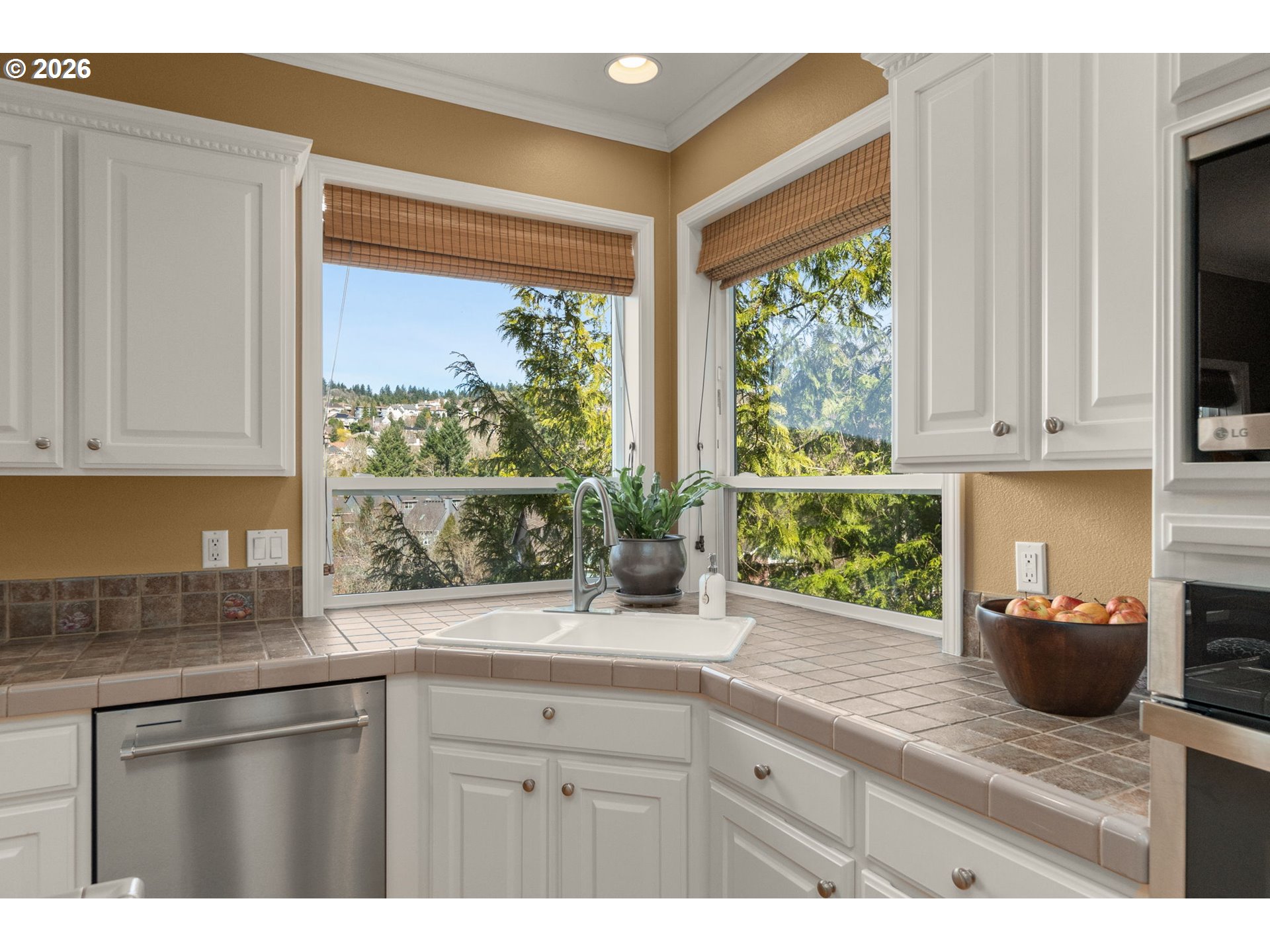 9625 Northwest Fleischner Street Portland, OR 97229 - Photo 18 of 39 a kitchen with stainless steel appliances granite countertop a stove a sink and a microwave