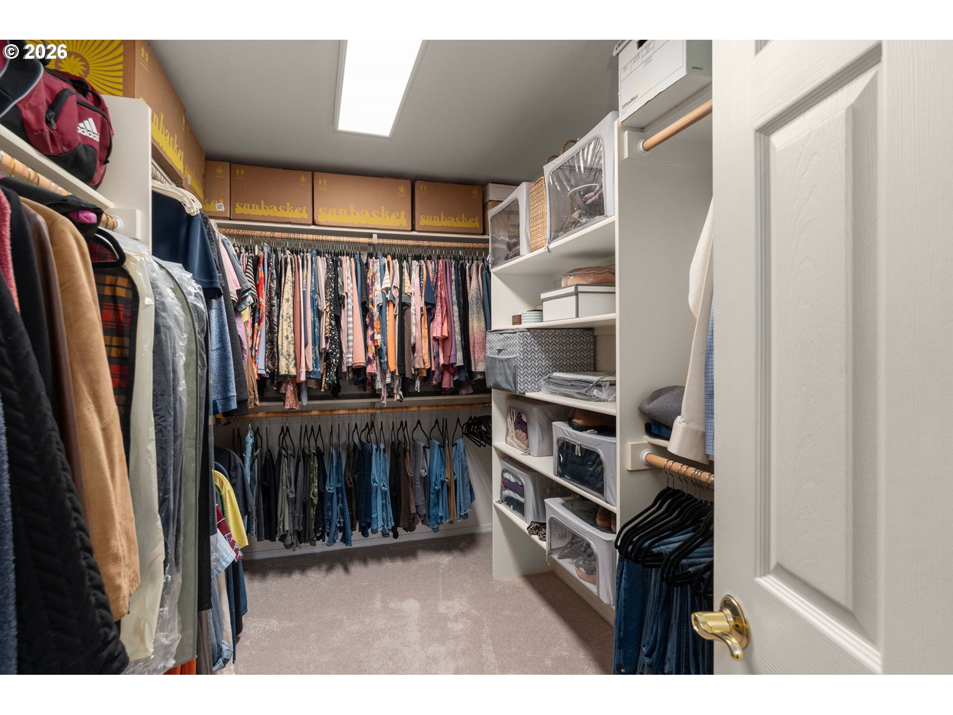 9625 Northwest Fleischner Street Portland, OR 97229 - Photo 25 of 39 a view of walk in closet with clothes and shoes