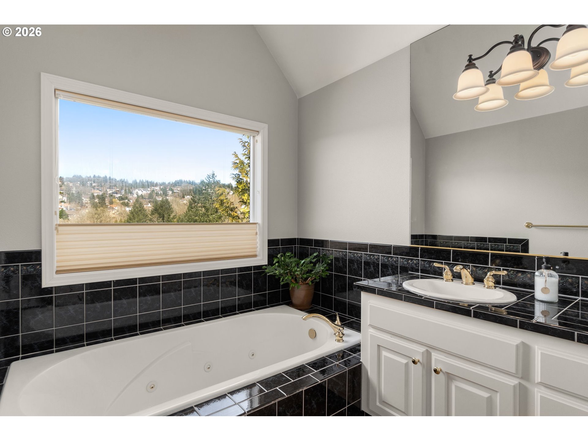 9625 Northwest Fleischner Street Portland, OR 97229 - Photo 26 of 39 a bathroom with a bathtub and a sink