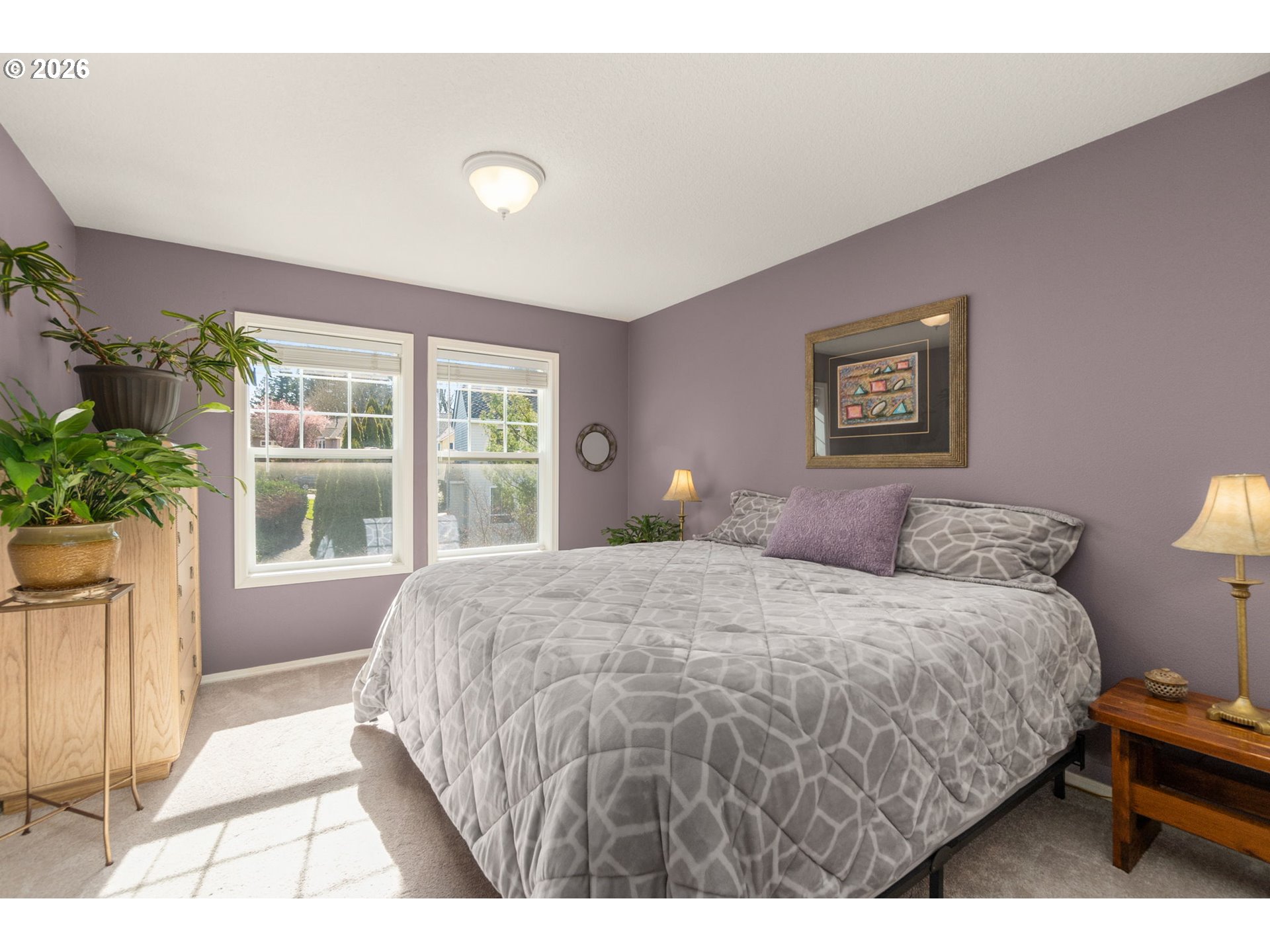 9625 Northwest Fleischner Street Portland, OR 97229 - Photo 30 of 39 a bedroom with a large bed and a window