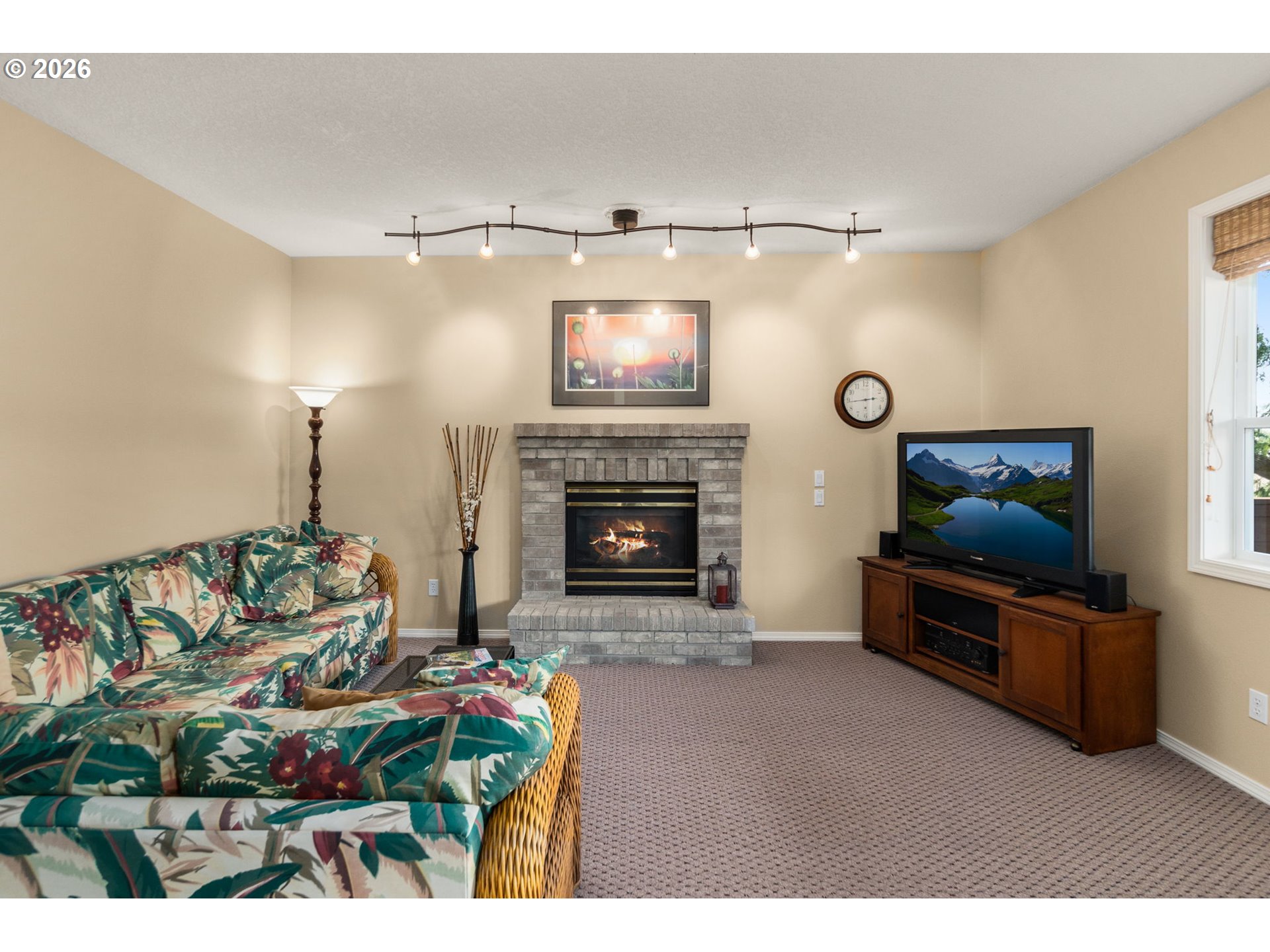 9625 Northwest Fleischner Street Portland, OR 97229 - Photo 37 of 39 a living room with furniture and a fireplace