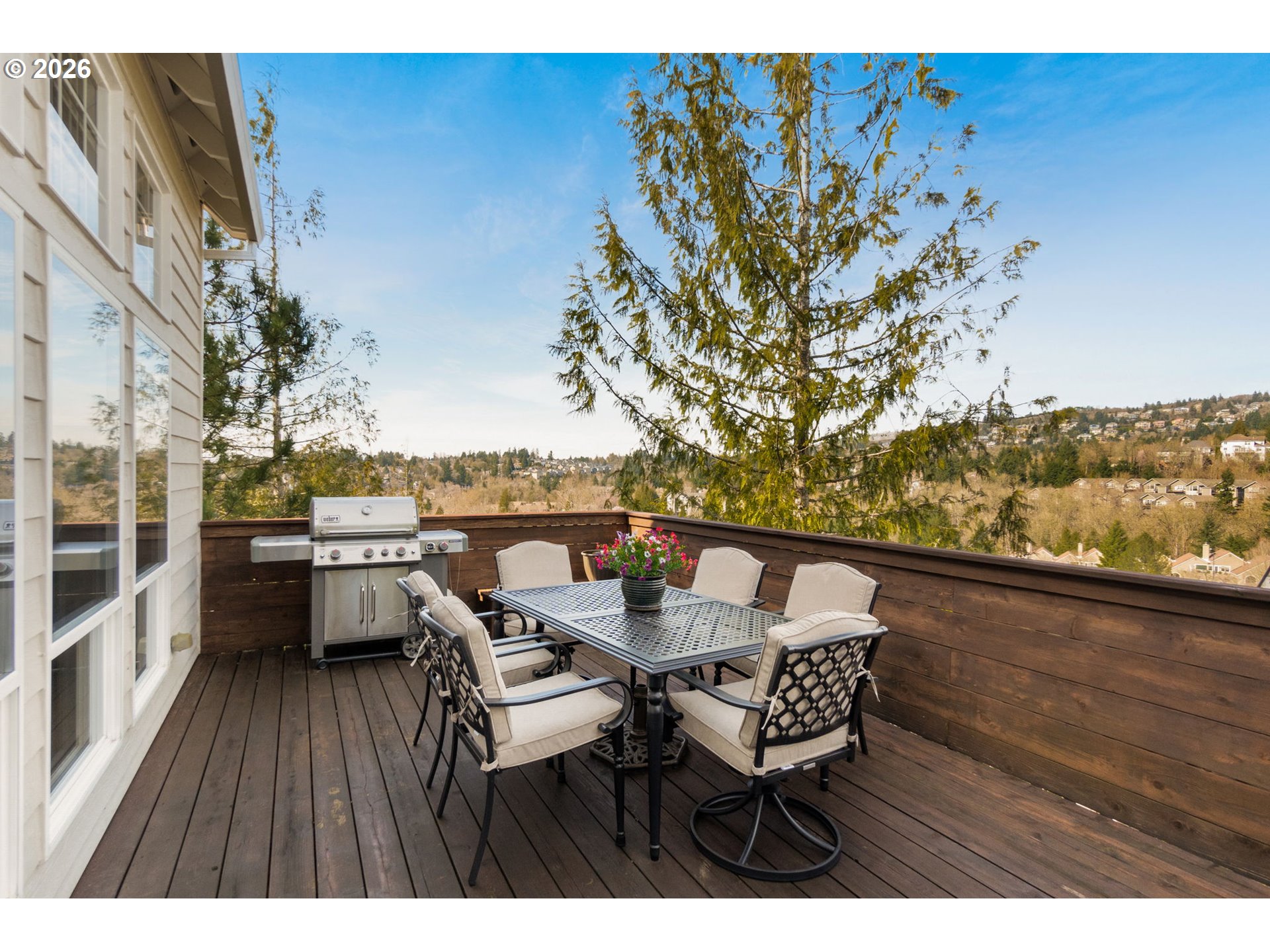9625 Northwest Fleischner Street Portland, OR 97229 - Photo 10 of 39 a view of a balcony with table and chairs