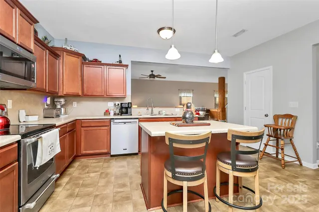 a kitchen that has a table and chairs in it