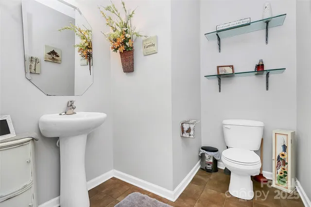 a bed sitting in a room next to a window