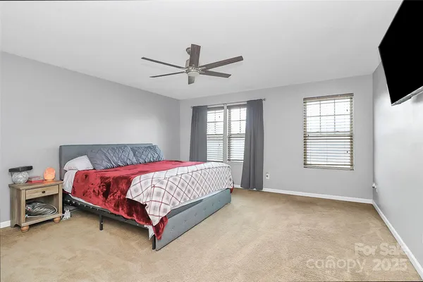 a bedroom with a bed and a chair
