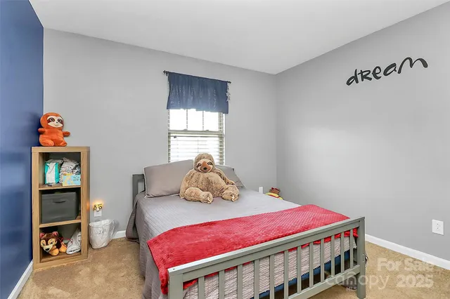 a bedroom with a bed and a cabinets