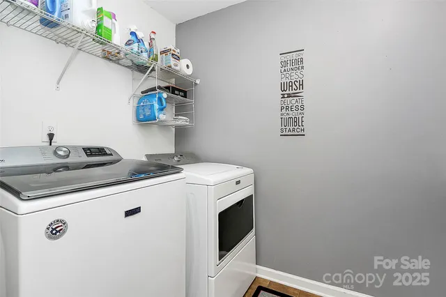 a living room with furniture and wooden floors