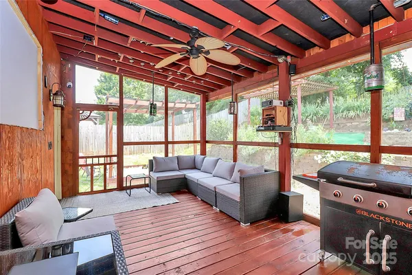 a view of a chairs and a table in the patio