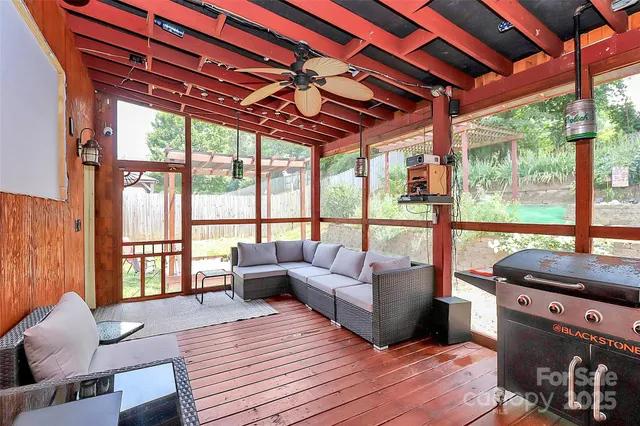 a view of a chairs and a table in the patio
