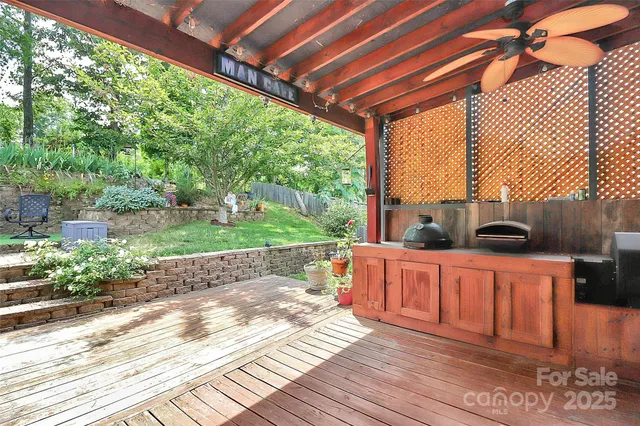 a view of a backyard with sitting area